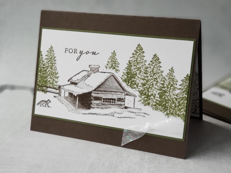 This peaceful Christmas card is easy to duplicate with this handy masking technique - made with the Stampin Up Peaceful Cabin stamp.