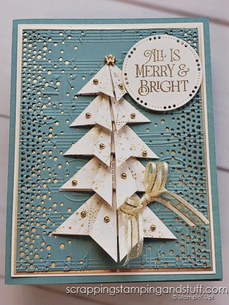 Click to see this stunning card featuring a paper folded Christmas tree you can create in minutes! Background features the Stampin Up Brightest Glow bundle.