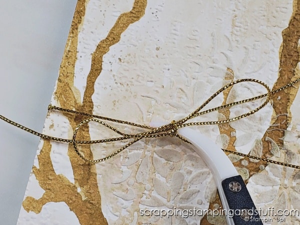 Click to see this quick tip to hold ribbon while tying bows! Reverse tweezers are a life-saver!